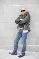 Obraz premium Man in jeans and a leather jacket