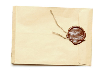 red wax seal on yellow envelope