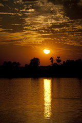 Obraz premium Sunset over a large river