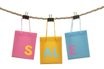 Shopping bags with the word sale on white