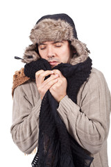 man with cold wearing a scarf and a bonnet