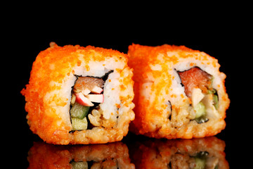 delicious sushi on black background