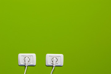 electric outlets on green wall