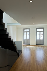 interior loft, stairs and windows in the background
