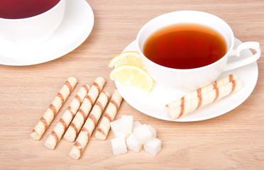 Two cups of tea with sugar