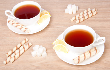 Two cups of tea with sugar