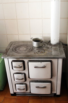 old wood stove in a kitchen of a house in the mountains