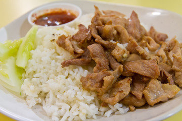Cooked rice with fried pork