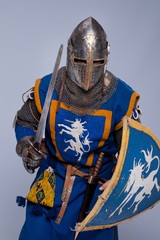 Medieval knight on grey background.