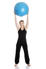 Young girl with fit ball