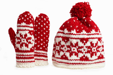 winter cap and mittens with knitted motifs. on white