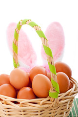 Easter basket with eggs and bunny ears