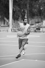 Fototapeta premium Basketball player running on the court