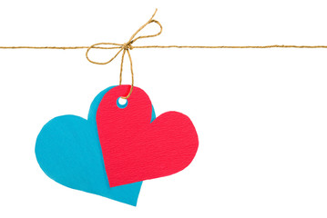 Red and blue paper hearts on rope