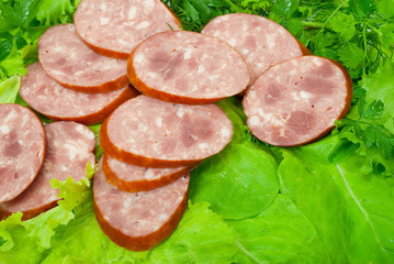 Sausage with green vegetable
