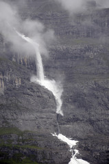 Avalanche falling down rock face of Jungfrau