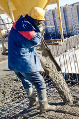 Construction worker during concrete pouring works