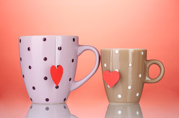 Two cups and tea bags with red heart-shaped label