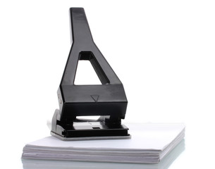 Black office hole punch with paper isolated on white