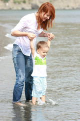 mother and son playing on beach