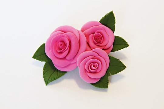 Fototapeta Artificial flowers (three big red roses with leaves)