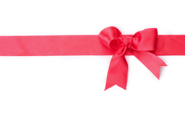 Red ribbon with bow on white