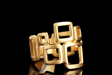 beautiful gold ring on black background
