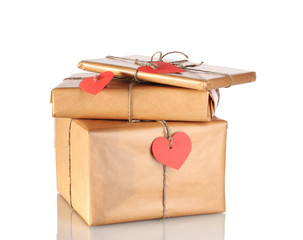 Three parcels with blank heart-shaped labels isolated on white