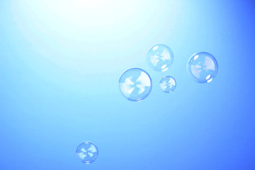 Soap bubble on blue background