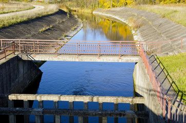 River dam and reflections on water background