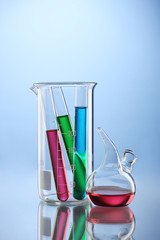 Laboratory glassware with color liquid and with reflection