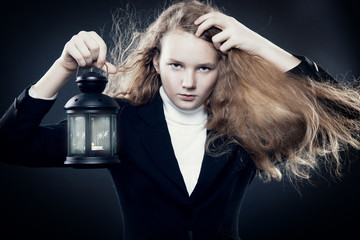Beautiful young girl bears a lantern