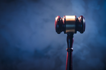 judge gavel on blue background