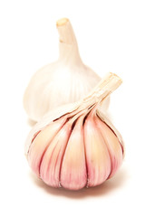 Rose or pink garlic bulbs isolated on a white studio background.