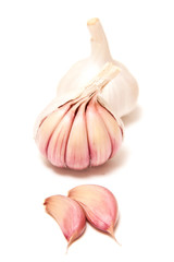 Rose or pink garlic bulbs isolated on a white studio background.