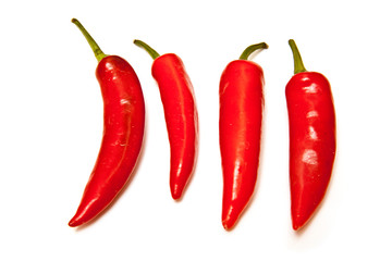 Red chilli peppers isolated on a white studio background.