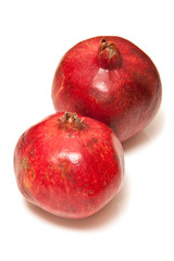 Pomegranates isolated on a white studio background.