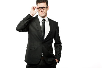 Handsome businessman in black suit on white.