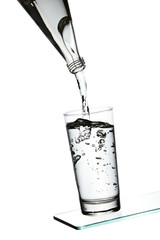 Pouring water into glass