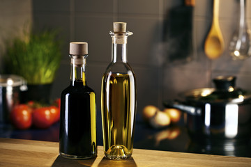 Oil and vingar bottles in front of a kitchen