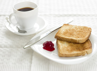 Breakfast with toast,raspberry marmalade and coffee