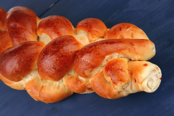 golden challah on blue