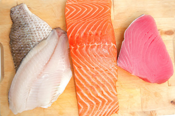 salmon , red tuna , and sole fish pieces