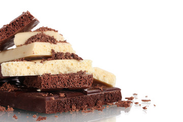 Slices of milk and white chocolate bar with chocolate shavings