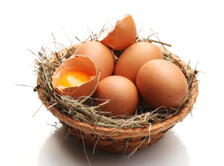chicken eggs in a nest isolated on white