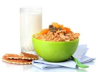 tasty cornflakes in green bowl and glass of milk isolated