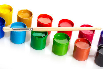 Paint buckets with paintbrush over white background