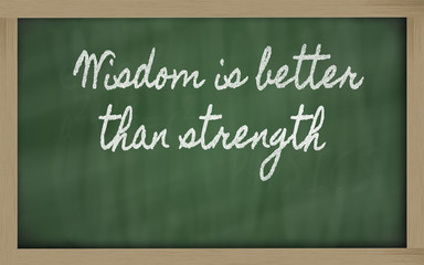 Obraz premium expression - Wisdom is better than strength - written on a scho