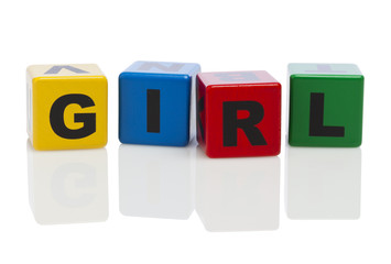 Girl spelled out in alphabet building blocks