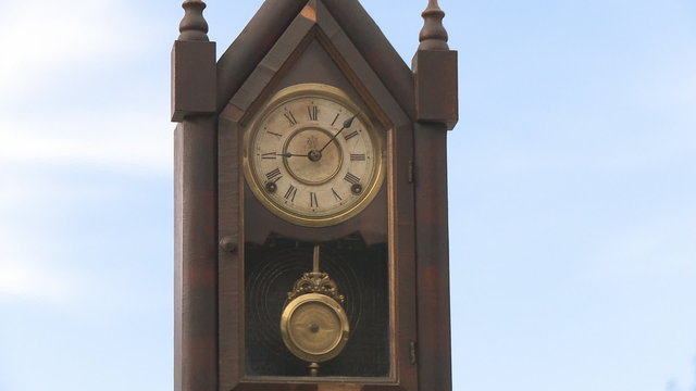 Old clock pendulum on the sky
